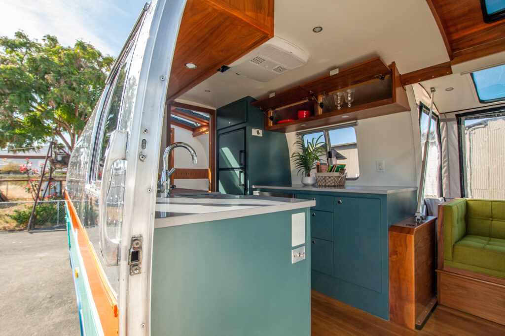 Kitchen of the MXB with cabinets and a sink